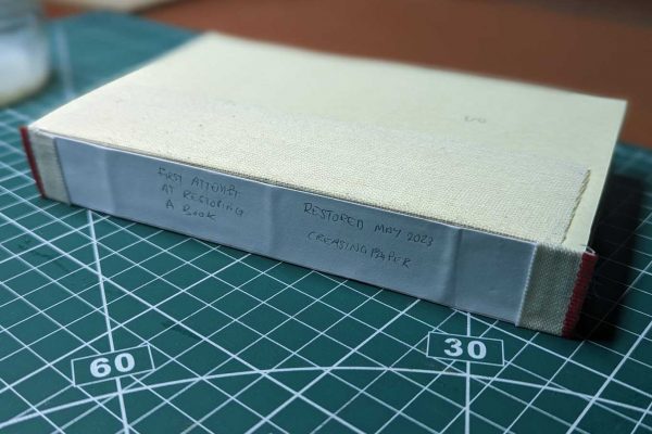 Paper backing attached to the spine