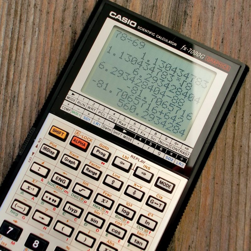 Scientific Calculator on Wooden Surface